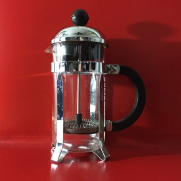 Coffee Press on red background