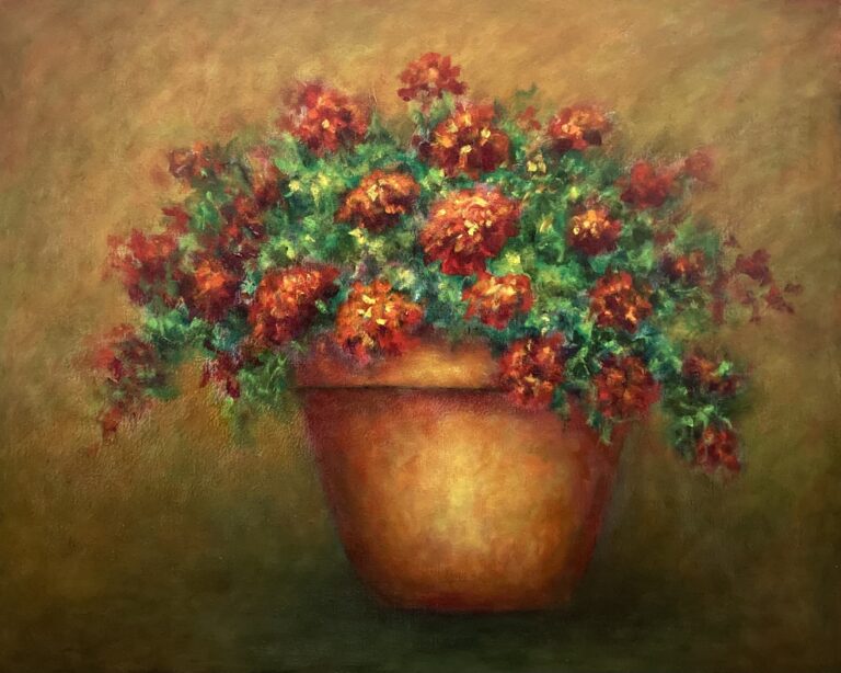 Terra Cotta pot of red geraniums set against a warm gold background